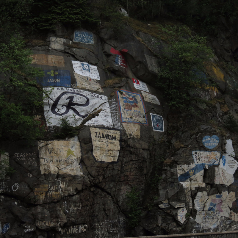 Some of the Painted Ship signs on the rocks by the dock