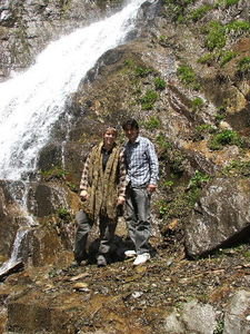 Didar and I beside a waterfall