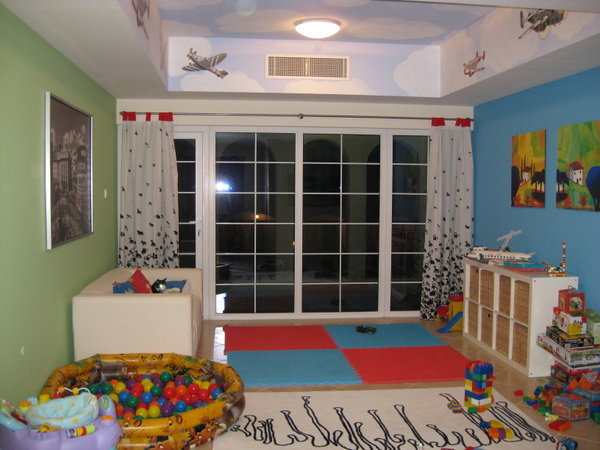 I miss clouds here, so painted them on the ceiling in the playroom instead!