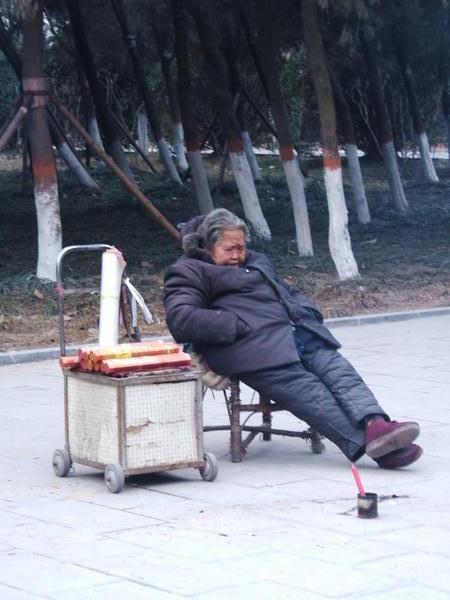 Old woman selling incense
