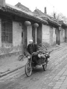 An old man collecting rubbish
