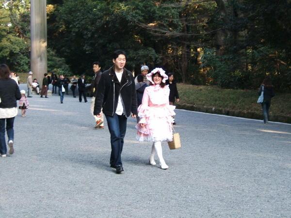 Japanese couple strolling in the park..