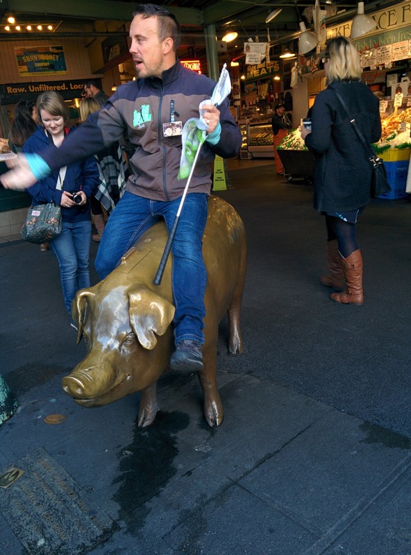 Our market tour guide riding a brass pig
