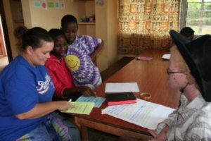 Julie studying with some of the workers there at the orphanage