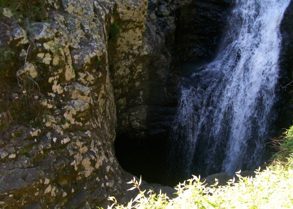 Waterfall falling into the cave, II
