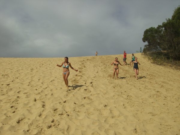 Running down sand dunes into Lake Wabbi