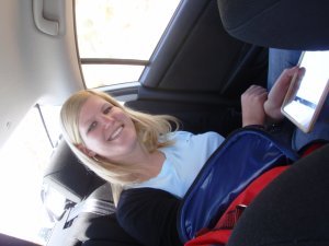 Tanja smiling in the car