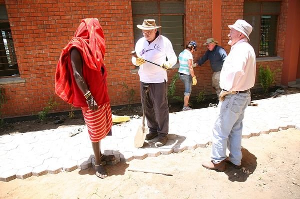 A Maasai guard shows Bob his club