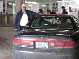 My master with the car at the Buick dealership!