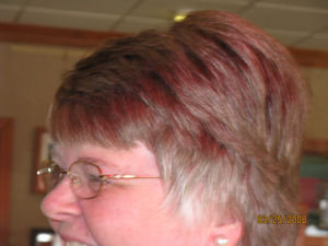 Sharon and her dyed hair! Actually the sun shone through the red window blind at the restaurant and landed on her hair!