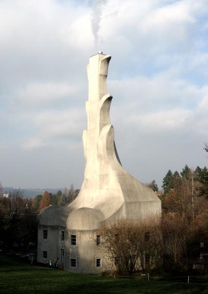 I believe its a chimney for a  smokehouse.