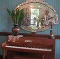 small piano and a beautiful mirror