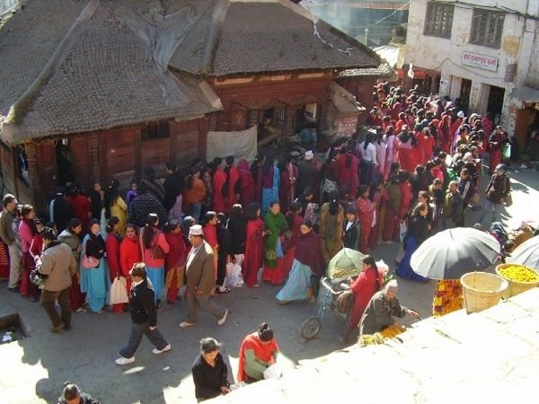 Women queueing to give offerings at a Ganesh shrine, Kathmandu