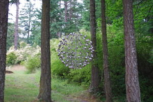 Another sculpture hanging in the trees