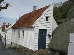 Home built right alongside a boulder in Skudeneshavn