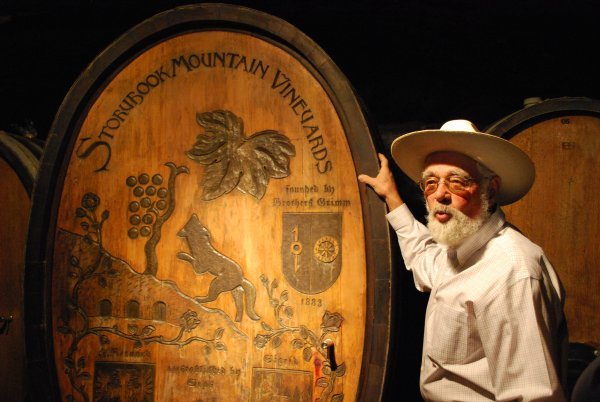 The winemaker explaining the significance of the decorative barrel at Storybook Mountain Vineyard 
