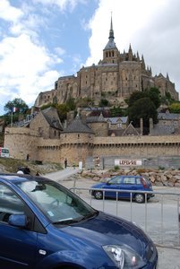 Standing next to our car at Mont Saint-Michel; look how great of a parking spot we snagged!