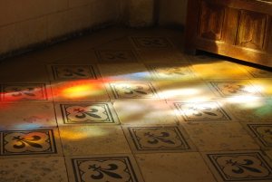 Stained glass reflection on tiles
