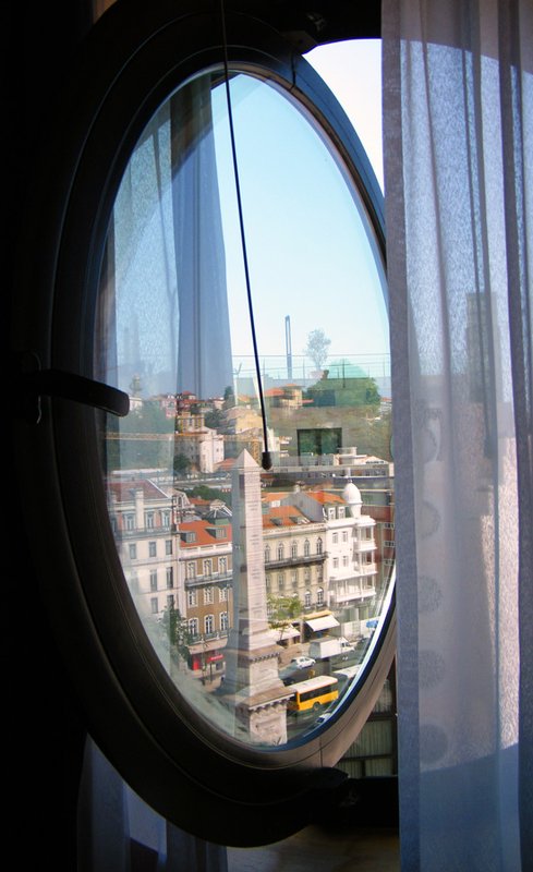 Reflection of Lisbon in hotel window