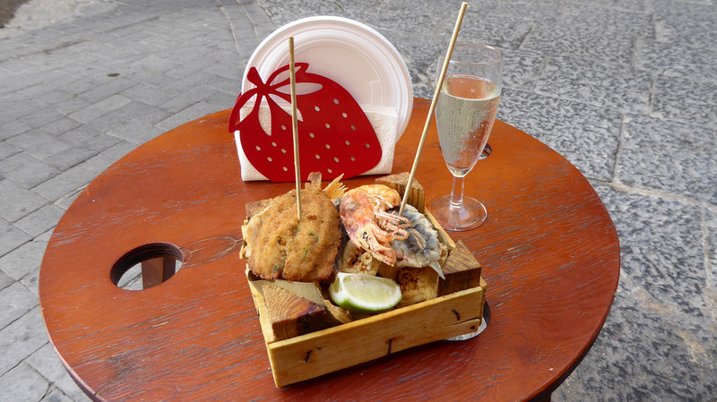 Street food -- seafood and a glass of Prosecco
