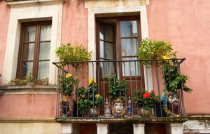 Balcony in Taormina with ceramic pots 