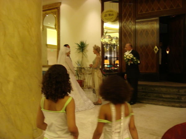 Cute little girls looking at bride