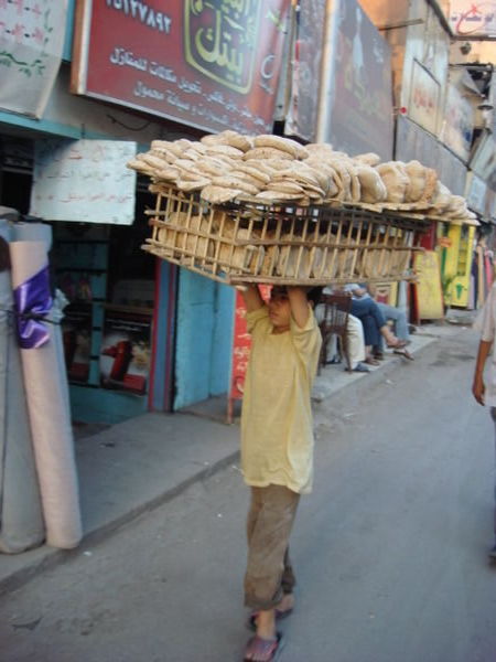 Teen transporting pita bread