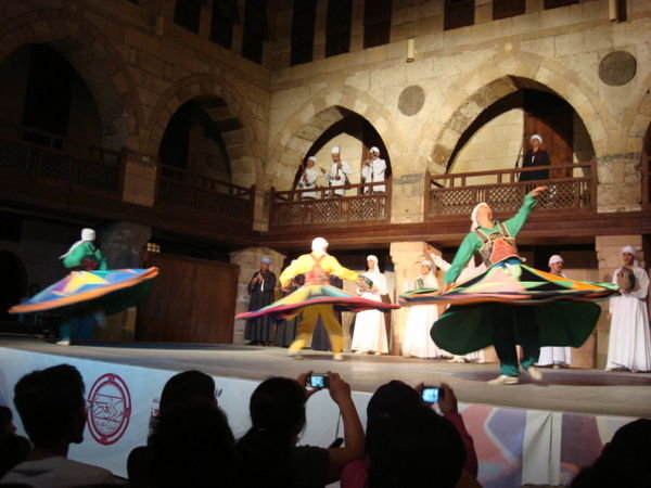 Dervishes whirling on the outdoor stage