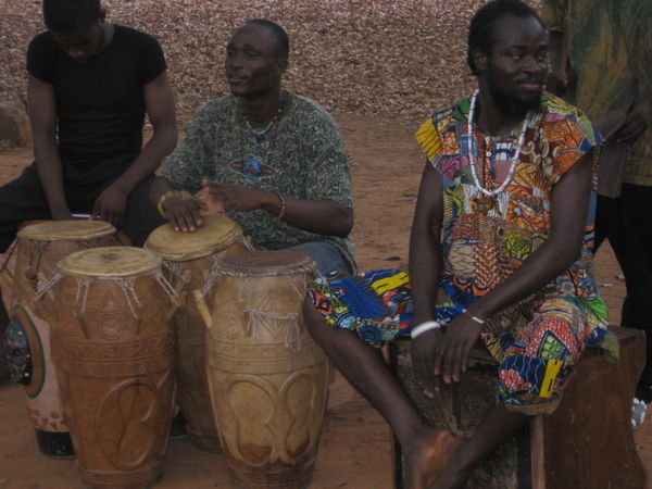 Gidi, Ahefe, and Ouwo playing the drums