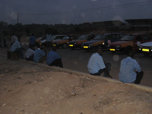 taxi's and their drivers waiting at our junction for any customers