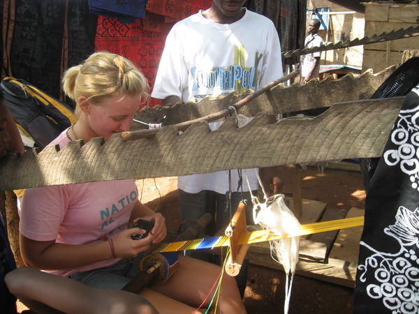 Meghan weaving leraning how to weave cloth