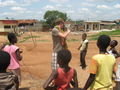 Brendan attempting to jump rope with some girls in the village