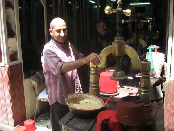 a man making hats in the bazaar