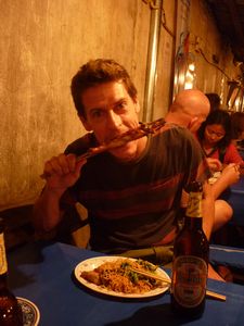 LAOS: Luang Prabang - how about half a chicken on a stick?