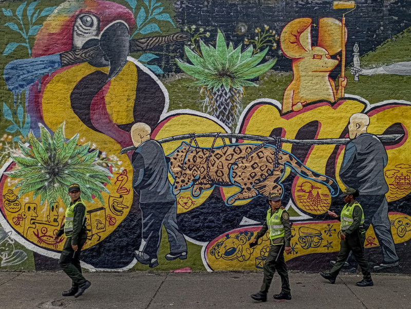 Street art in Cali, with police patrol