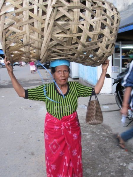 Karo woman carrying a heavy load