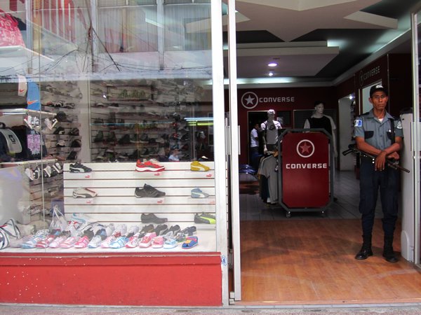 Armed security guard at almost every single shop, even this shoe shop