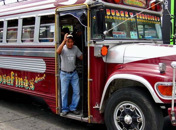Bus conductor in Guatemala City