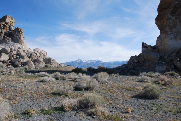 Tufa and Distant Snow-capped Mountains