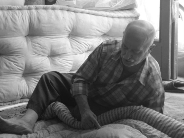 Old man making blankets