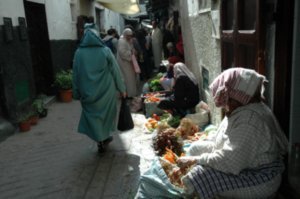 lot's of older ladies selling their fruits and veggies