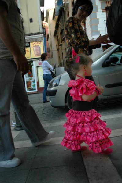 this was a little girl in traditional flamenca wear