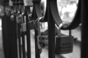 this was in front of a church and I guess couples have written their names on locks and put them on the fence