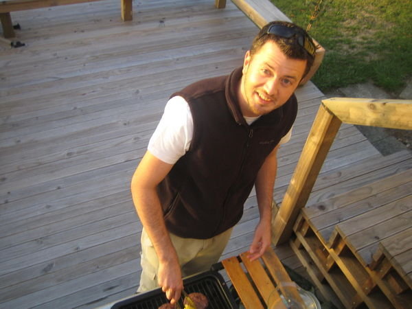 Phil cooking on the Barbie on his Deck