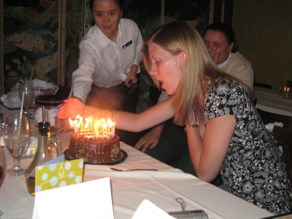 Leanne trying to blow out the trick candles