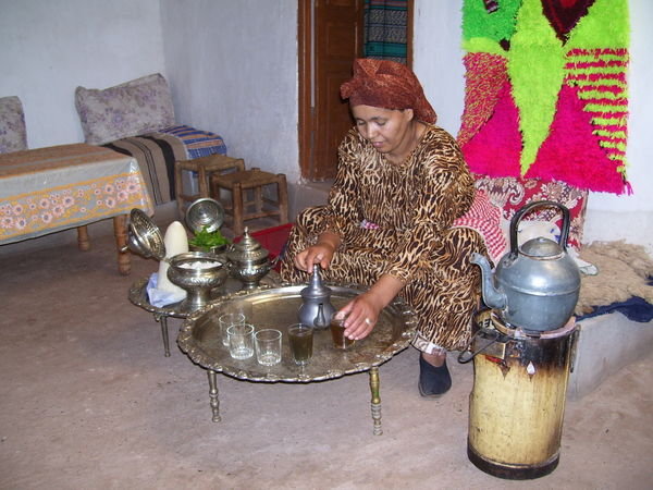 Berber woman serving mint tea