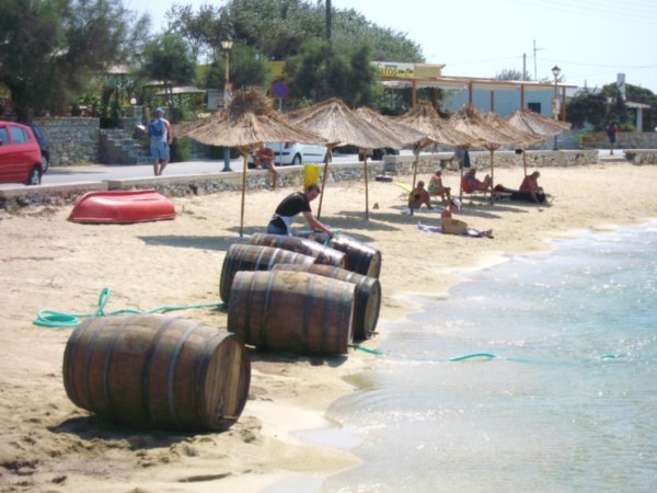 Washing wine barrels on the beach