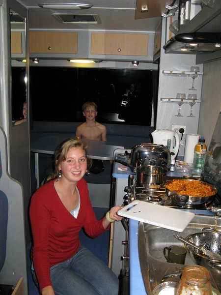 Sydney makes dinner in the Camper Van!