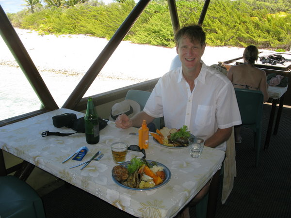 Gregg shows off lunch on the boat.