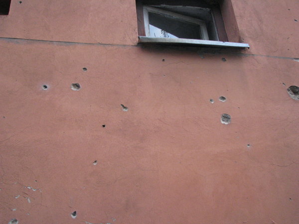 Bullet holes in the wall.